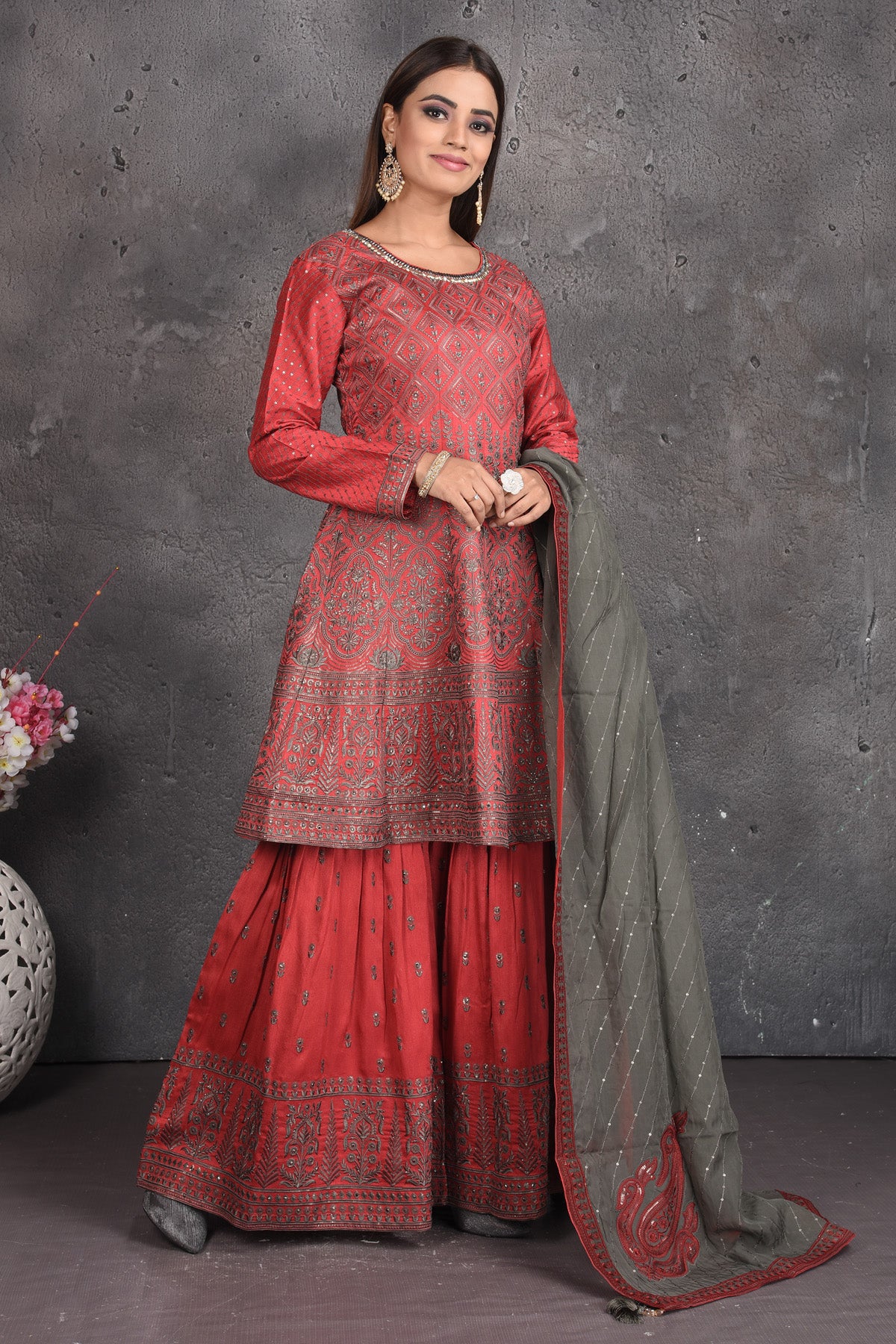Buy beautiful tomato red embroidered sharara suit online in USA with grey dupatta. Set a fashion statement at parties in designer dresses, Anarkali suits, designer lehengas, gowns, Indowestern dresses from Pure Elegance Indian fashion store in USA.-right