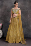 Buy stunning mustard embroidered off-shoulder lehenga online in USA with dupatta. Set a fashion statement at parties in designer Indian dresses, Anarkali suits, designer lehengas, gowns, Indowestern dresses from Pure Elegance Indian fashion store in USA.-full view