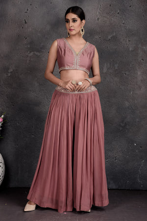 Buy stunning dusty pink embroidered skirt set online in USA with shrug. Set a fashion statement at parties in designer Indian suits, Anarkali suits, designer lehengas, gowns, Indowestern dresses from Pure Elegance Indian fashion store in USA.-front