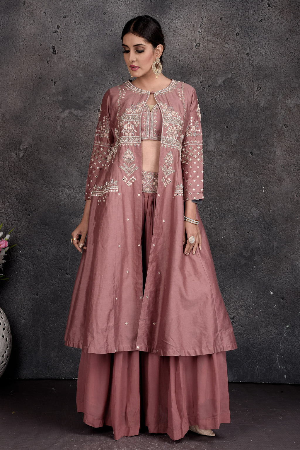 Buy stunning dusty pink embroidered skirt set online in USA with shrug. Set a fashion statement at parties in designer Indian suits, Anarkali suits, designer lehengas, gowns, Indowestern dresses from Pure Elegance Indian fashion store in USA.-full view