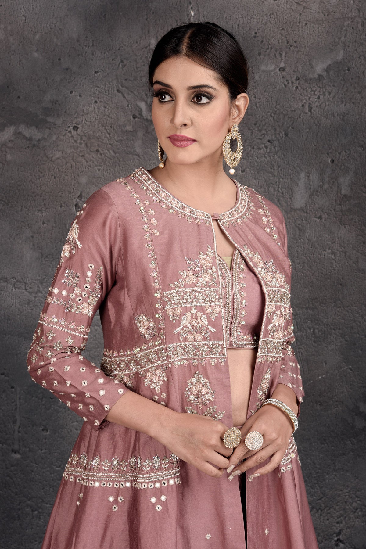 Buy stunning dusty pink embroidered skirt set online in USA with shrug. Set a fashion statement at parties in designer Indian suits, Anarkali suits, designer lehengas, gowns, Indowestern dresses from Pure Elegance Indian fashion store in USA.-closeup