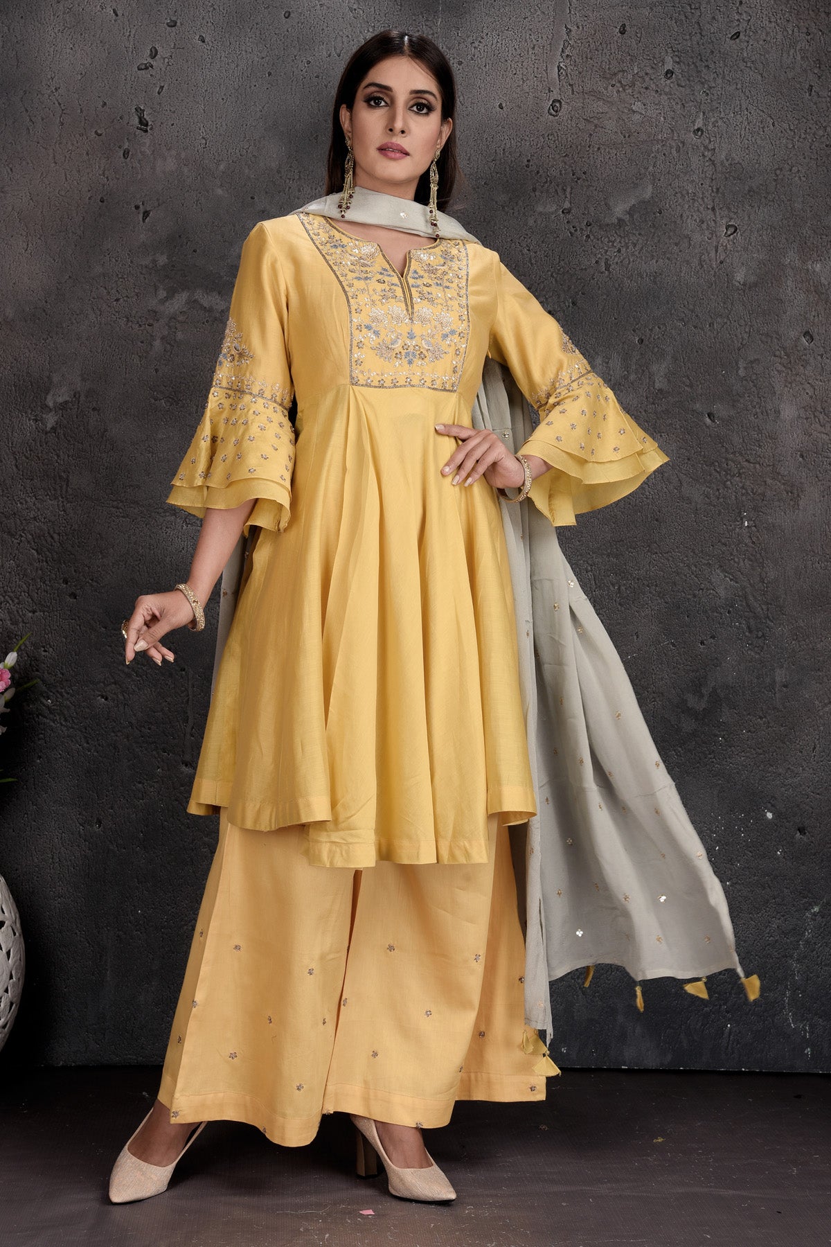 Shop stunning light yellow palazzo suit online in USA with grey dupatta. Set a fashion statement at parties in designer Indian suits, Anarkali suits, designer lehengas, gowns, Indowestern dresses from Pure Elegance Indian fashion store in USA.-side