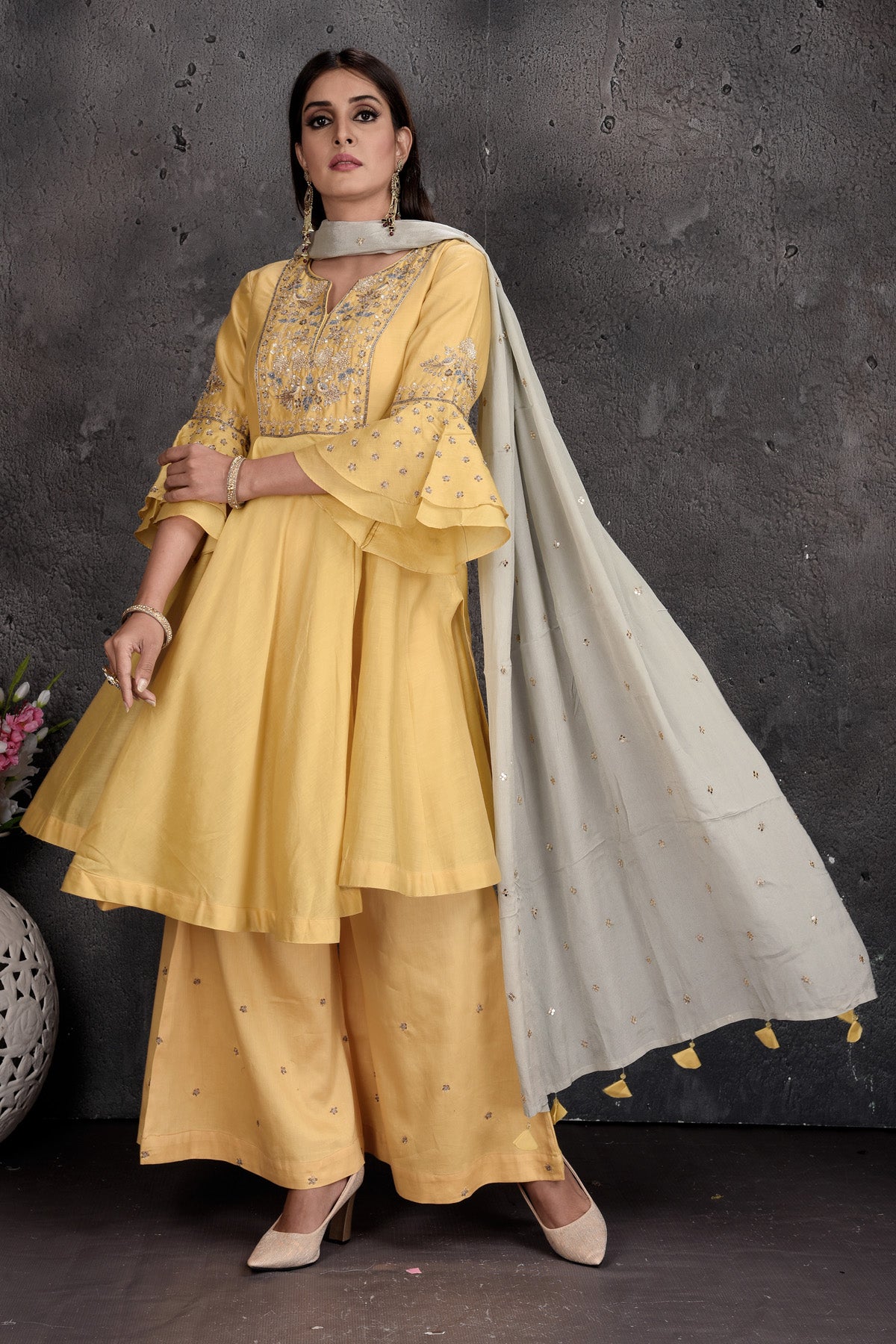 Shop stunning light yellow palazzo suit online in USA with grey dupatta. Set a fashion statement at parties in designer Indian suits, Anarkali suits, designer lehengas, gowns, Indowestern dresses from Pure Elegance Indian fashion store in USA.-left