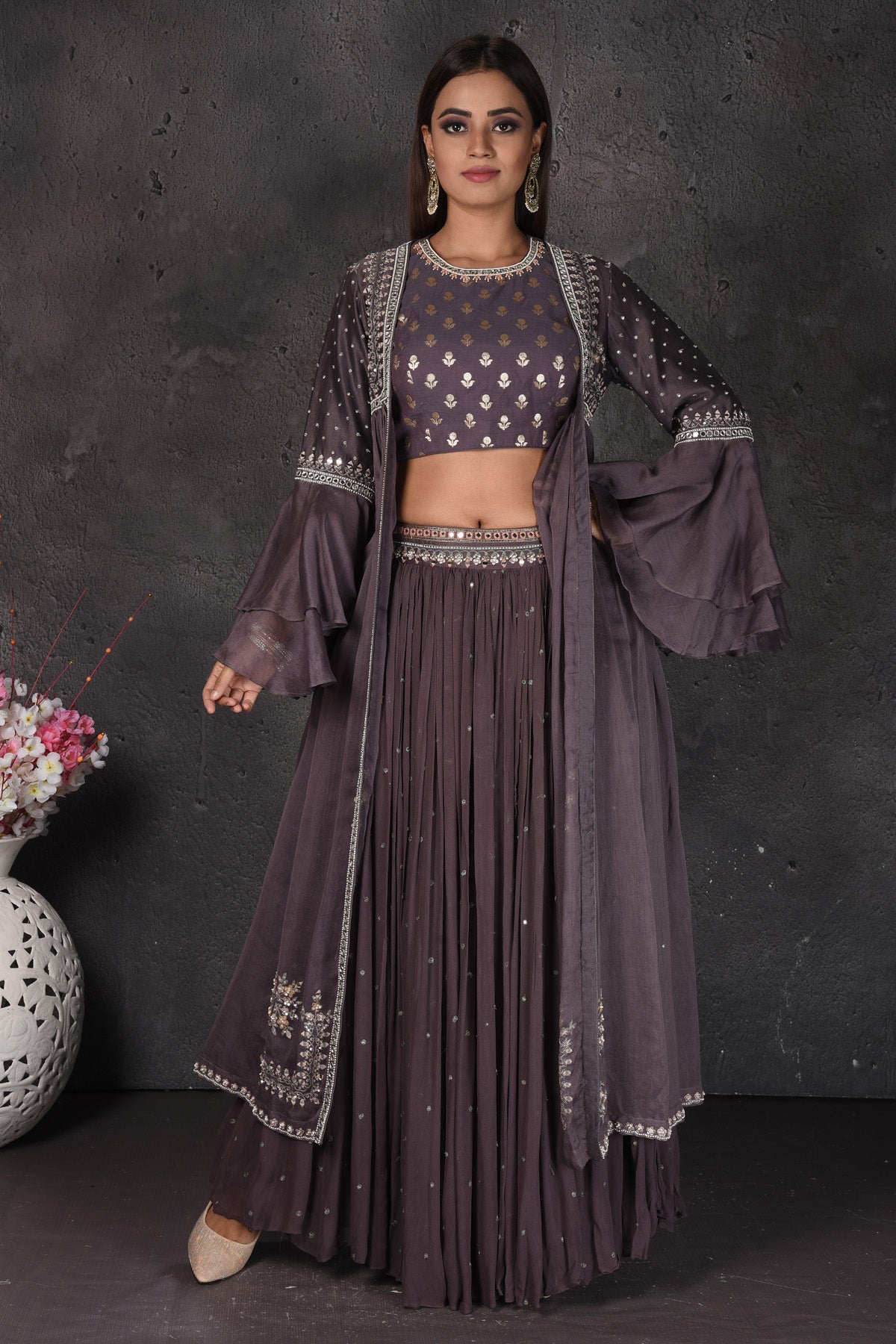 Shop stunning dark grey embroidered crop top skirt online in USA with cape. Set a fashion statement at parties in designer dresses, Anarkali suits, designer lehengas, gowns, Indowestern dresses from Pure Elegance Indian fashion store in USA.-full view