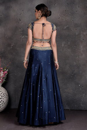 Buy stunning dark blue and embroidered designer lehenga online in USA with dupatta. Set a fashion statement at parties in designer Indian suits, Anarkali suits, designer lehengas, gowns, Indowestern dresses from Pure Elegance Indian fashion store in USA.-back