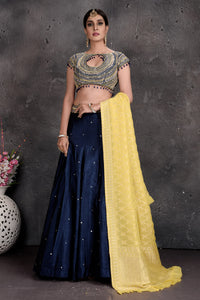 Buy stunning dark blue and embroidered designer lehenga online in USA with dupatta. Set a fashion statement at parties in designer Indian suits, Anarkali suits, designer lehengas, gowns, Indowestern dresses from Pure Elegance Indian fashion store in USA.-full view