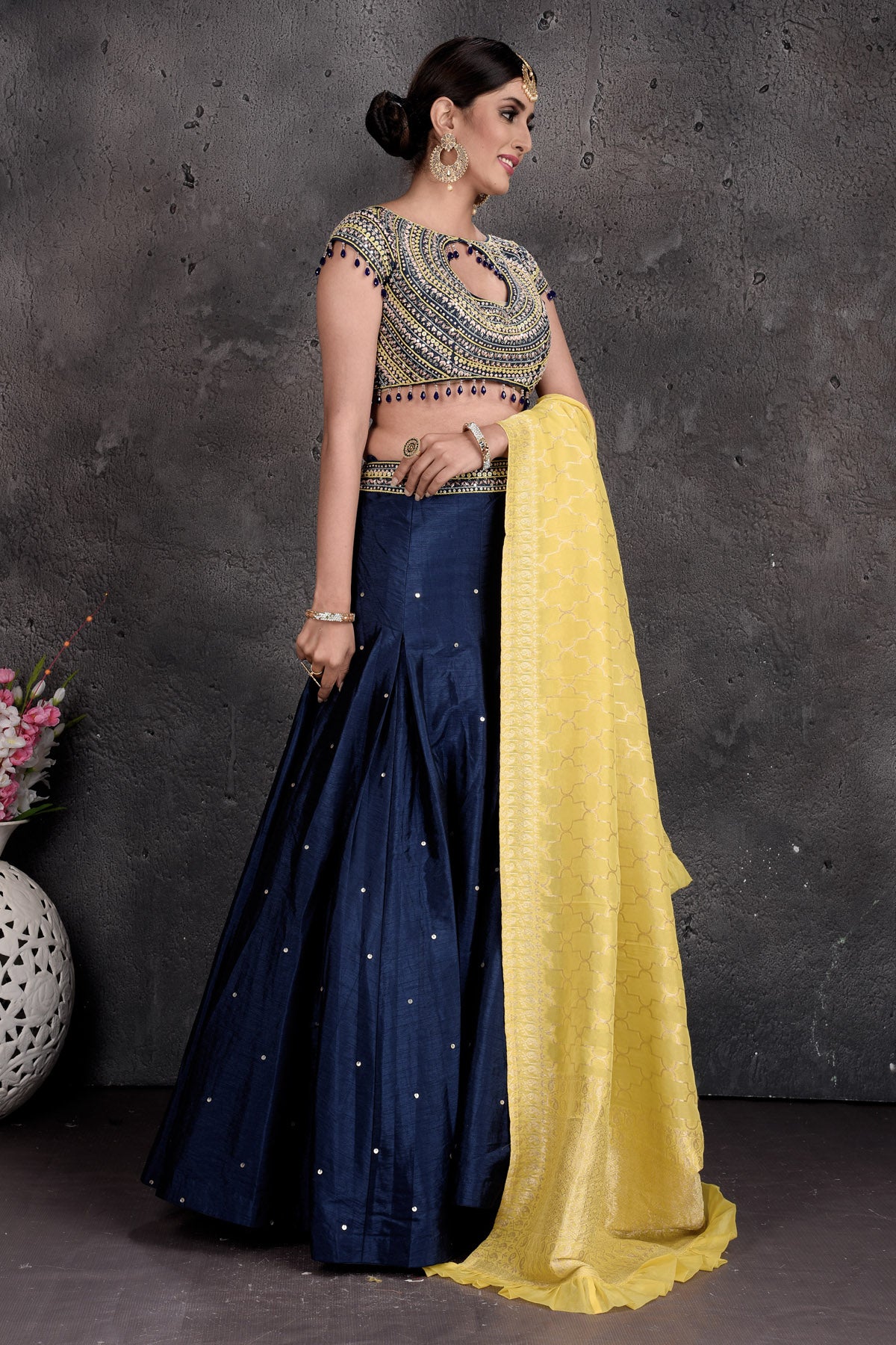 Buy stunning dark blue and embroidered designer lehenga online in USA with dupatta. Set a fashion statement at parties in designer Indian suits, Anarkali suits, designer lehengas, gowns, Indowestern dresses from Pure Elegance Indian fashion store in USA.-side
