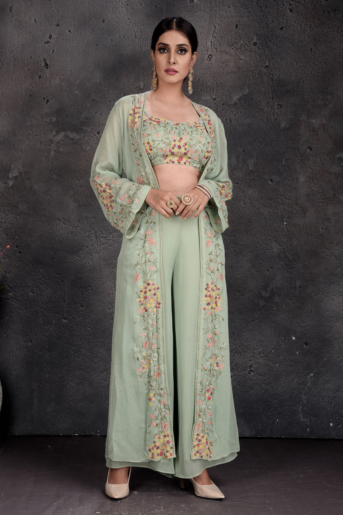 Shop stunning sage green embroidered palazzo and crop top online in USA with shrug. Set a fashion statement at parties in designer Indian suits, Anarkali suits, designer lehengas, gowns, Indowestern dresses from Pure Elegance Indian fashion store in USA.-full view