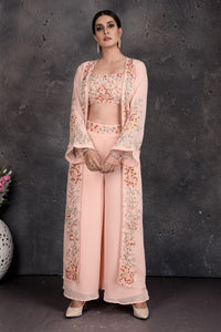 Shop stunning powder pink embroidered palazzo and crop top online in USA with shrug. Set a fashion statement at parties in designer Indian suits, Anarkali suits, designer lehengas, gowns, Indowestern dresses from Pure Elegance Indian fashion store in USA.-full view