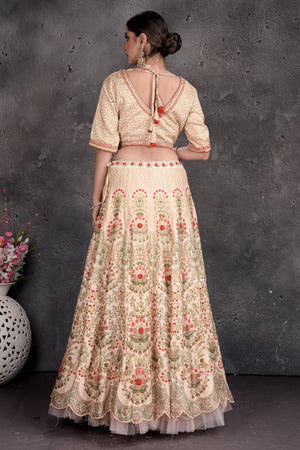 Buy stunning off-white floral embroidered lehenga online in USA with dupatta. Set a fashion statement at parties in designer Indian suits, Anarkali suits, designer lehengas, gowns, Indowestern dresses from Pure Elegance Indian fashion store in USA.-back