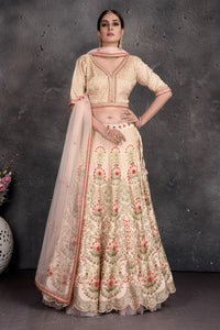 Buy stunning off-white floral embroidered lehenga online in USA with dupatta. Set a fashion statement at parties in designer Indian suits, Anarkali suits, designer lehengas, gowns, Indowestern dresses from Pure Elegance Indian fashion store in USA.-full view