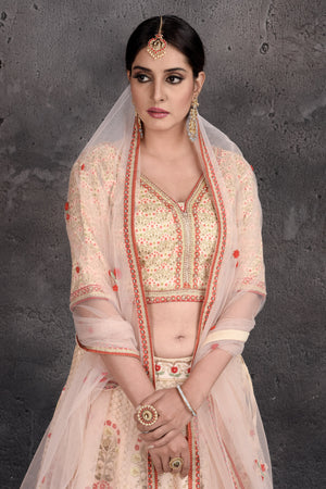 Buy stunning off-white floral embroidered lehenga online in USA with dupatta. Set a fashion statement at parties in designer Indian suits, Anarkali suits, designer lehengas, gowns, Indowestern dresses from Pure Elegance Indian fashion store in USA.-closeup