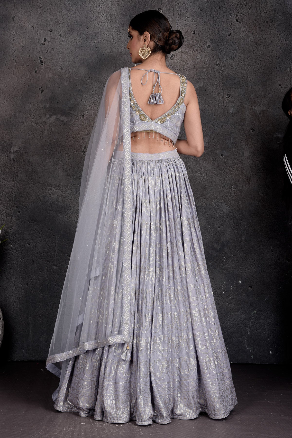 Buy beautiful light grey embroidered designer lehenga online in USA with dupatta. Set a fashion statement at parties in designer Indian suits, Anarkali suits, designer lehengas, gowns, Indowestern dresses from Pure Elegance Indian fashion store in USA.-back
