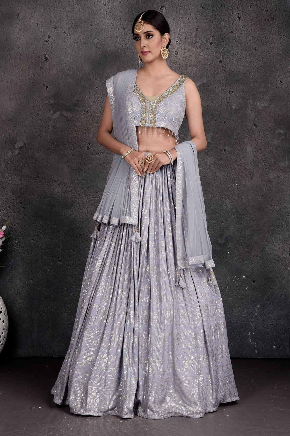 Buy beautiful light grey embroidered designer lehenga online in USA with dupatta. Set a fashion statement at parties in designer Indian suits, Anarkali suits, designer lehengas, gowns, Indowestern dresses from Pure Elegance Indian fashion store in USA.-full view