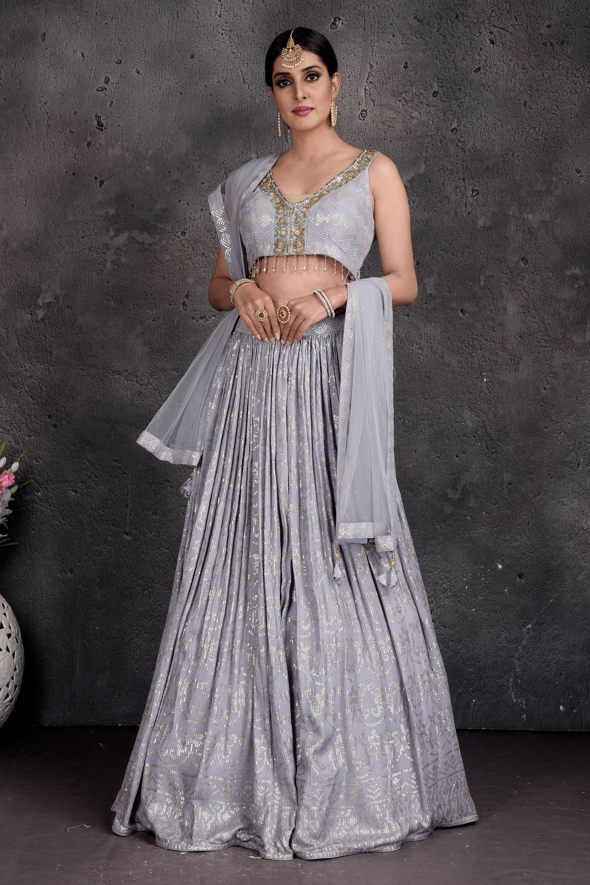Buy beautiful light grey embroidered designer lehenga online in USA with dupatta. Set a fashion statement at parties in designer Indian suits, Anarkali suits, designer lehengas, gowns, Indowestern dresses from Pure Elegance Indian fashion store in USA.-front