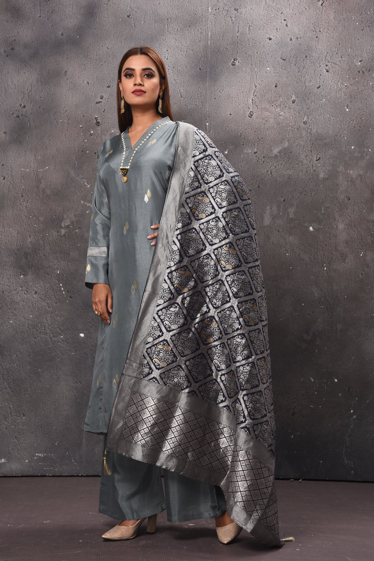 Shop stunning grey palazzo suit online in USA with matching dupatta. Get set for weddings and festive occasions in exclusive designer Anarkali suits, wedding gown, salwar suits, gharara suits, Indowestern dresses from Pure Elegance Indian fashion store in USA.-left