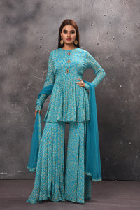 Buy stunning light blue gharara suit online in USA with matching dupatta. Get set for weddings and festive occasions in exclusive designer Anarkali suits, wedding gown, salwar suits, gharara suits, Indowestern dresses from Pure Elegance Indian fashion store in USA.-full view