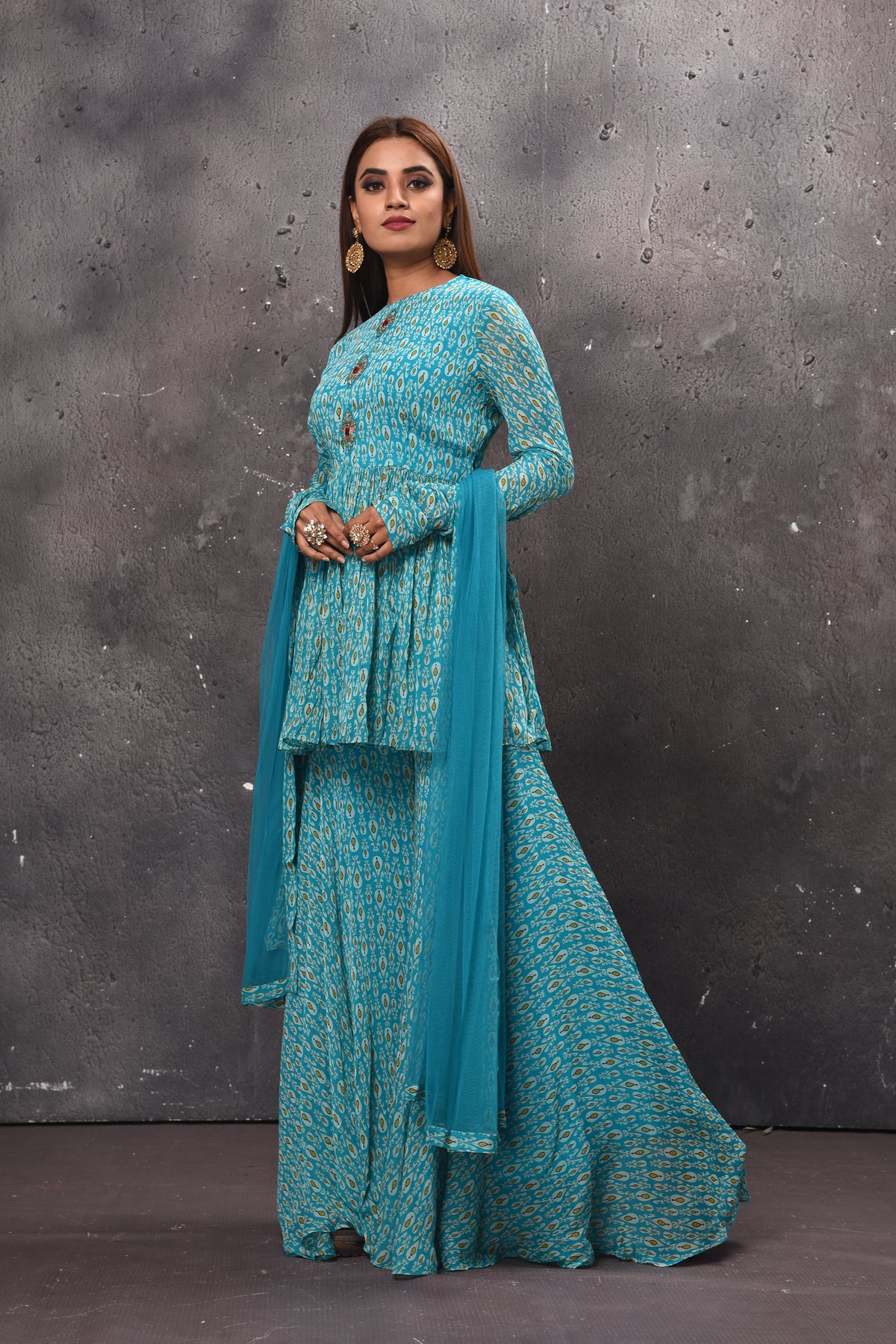 Buy stunning light blue gharara suit online in USA with matching dupatta. Get set for weddings and festive occasions in exclusive designer Anarkali suits, wedding gown, salwar suits, gharara suits, Indowestern dresses from Pure Elegance Indian fashion store in USA.-side
