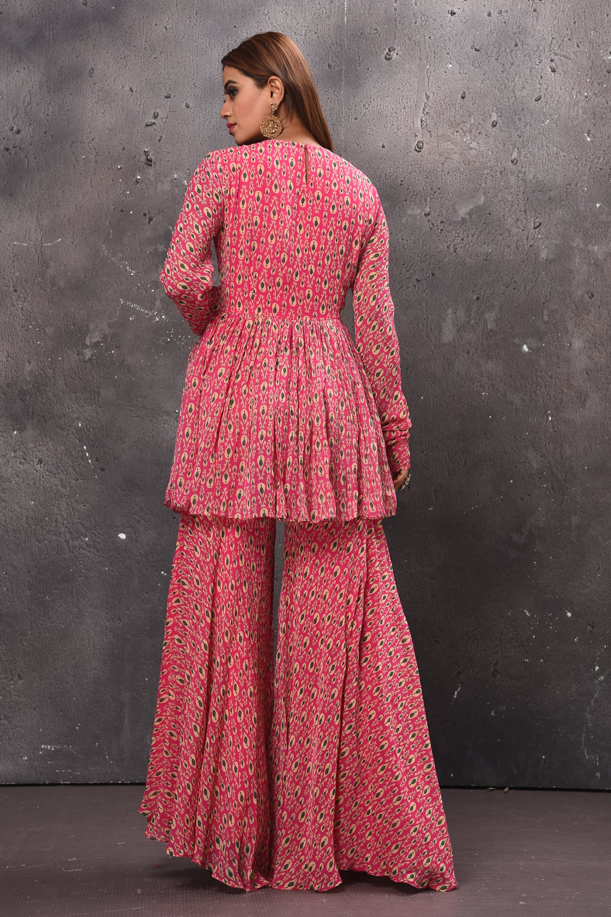 Buy stunning pink printed gharara suit online in USA with matching dupatta. Get set for weddings and festive occasions in exclusive designer Anarkali suits, wedding gown, salwar suits, gharara suits, Indowestern dresses from Pure Elegance Indian fashion store in USA.-back