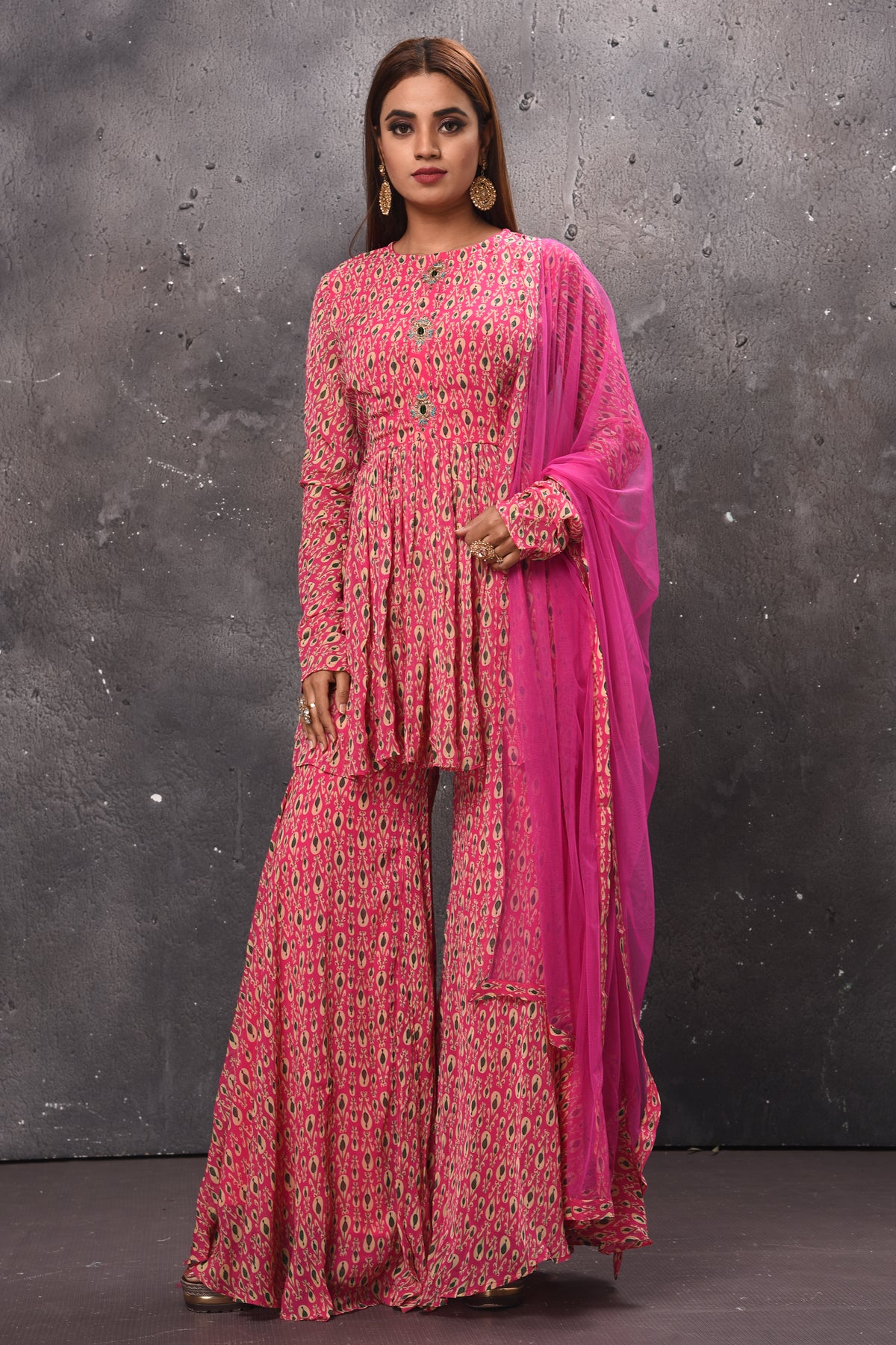Buy stunning pink printed gharara suit online in USA with matching dupatta. Get set for weddings and festive occasions in exclusive designer Anarkali suits, wedding gown, salwar suits, gharara suits, Indowestern dresses from Pure Elegance Indian fashion store in USA.-full view