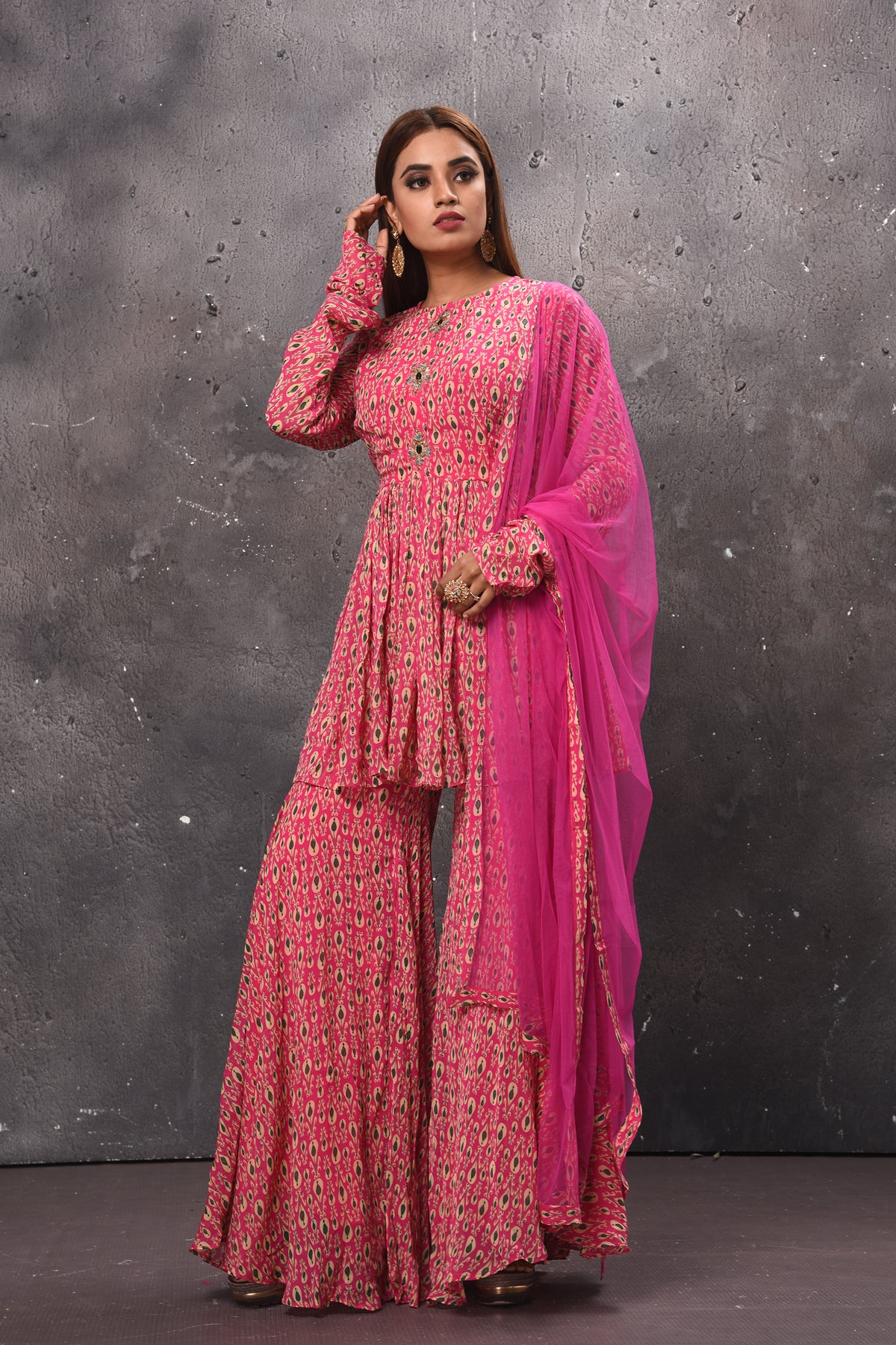 Buy stunning pink printed gharara suit online in USA with matching dupatta. Get set for weddings and festive occasions in exclusive designer Anarkali suits, wedding gown, salwar suits, gharara suits, Indowestern dresses from Pure Elegance Indian fashion store in USA.-left