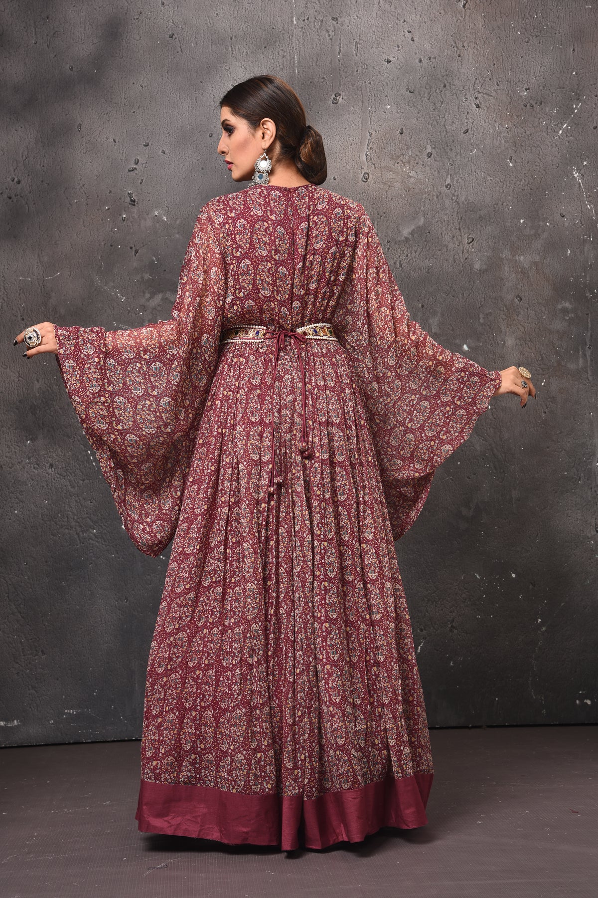 Shop gorgeous dark pink printed maxi dress online in USA with bell sleeves. Get set for weddings and festive occasions in exclusive designer Anarkali suits, wedding gown, salwar suits, gharara suits, Indowestern dresses from Pure Elegance Indian fashion store in USA.-back