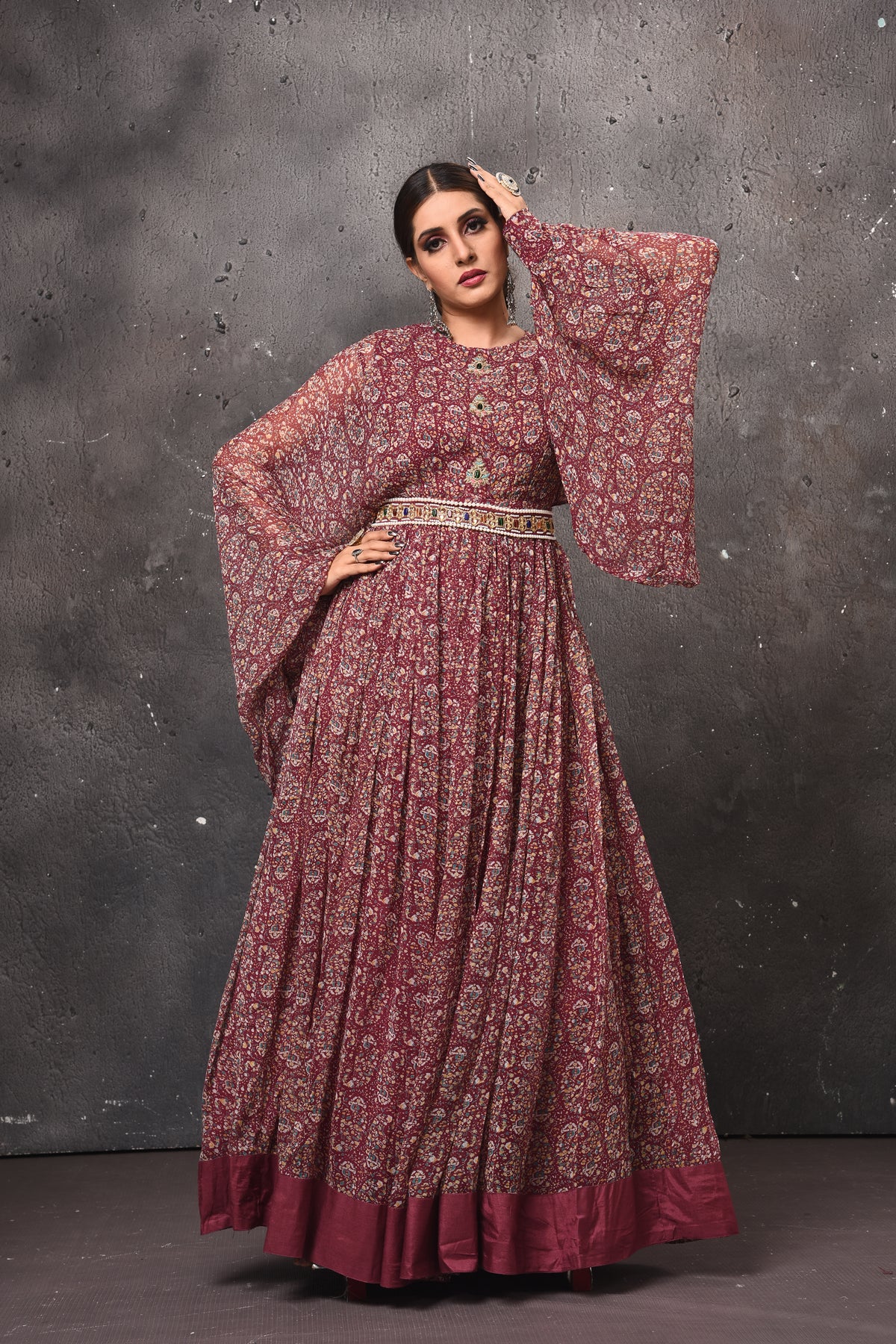 Shop gorgeous dark pink printed maxi dress online in USA with bell sleeves. Get set for weddings and festive occasions in exclusive designer Anarkali suits, wedding gown, salwar suits, gharara suits, Indowestern dresses from Pure Elegance Indian fashion store in USA.-front