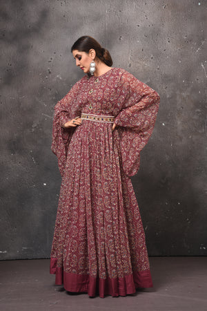 Shop gorgeous dark pink printed maxi dress online in USA with bell sleeves. Get set for weddings and festive occasions in exclusive designer Anarkali suits, wedding gown, salwar suits, gharara suits, Indowestern dresses from Pure Elegance Indian fashion store in USA.-side