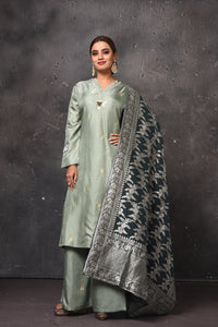Shop beautiful sage green palazzo suit online in USA with Banarasi dupatta. Get set for weddings and festive occasions in exclusive designer Anarkali suits, wedding gown, salwar suits, gharara suits, Indowestern dresses from Pure Elegance Indian fashion store in USA.-full view