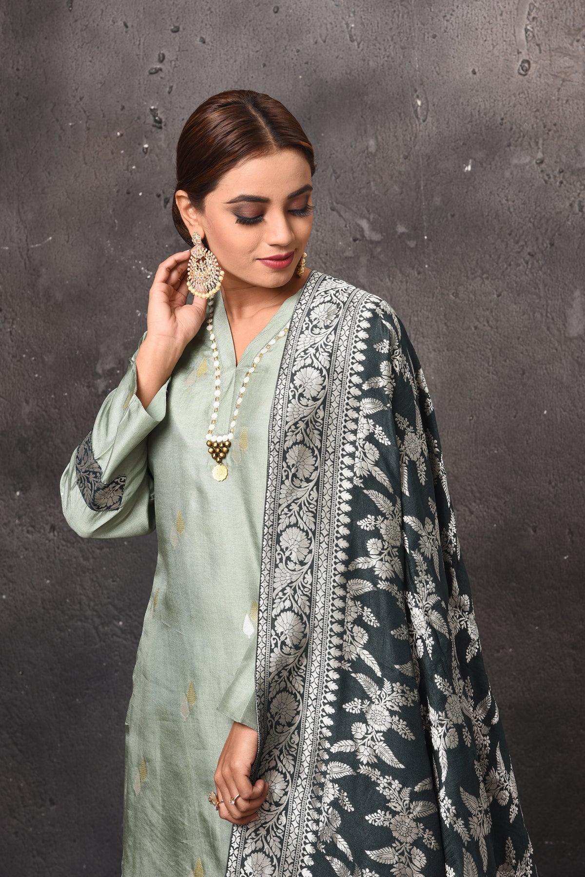 Shop beautiful sage green palazzo suit online in USA with Banarasi dupatta. Get set for weddings and festive occasions in exclusive designer Anarkali suits, wedding gown, salwar suits, gharara suits, Indowestern dresses from Pure Elegance Indian fashion store in USA.-closeup
