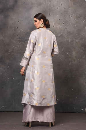 Shop stunning light grey palazzo suit online in USA with Banarasi dupatta. Get set for weddings and festive occasions in exclusive designer Anarkali suits, wedding gown, salwar suits, gharara suits, Indowestern dresses from Pure Elegance Indian fashion store in USA.-back