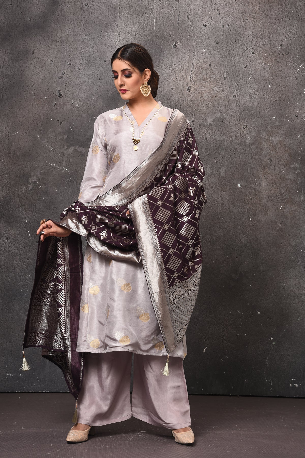 Shop stunning light grey palazzo suit online in USA with Banarasi dupatta. Get set for weddings and festive occasions in exclusive designer Anarkali suits, wedding gown, salwar suits, gharara suits, Indowestern dresses from Pure Elegance Indian fashion store in USA.-full view