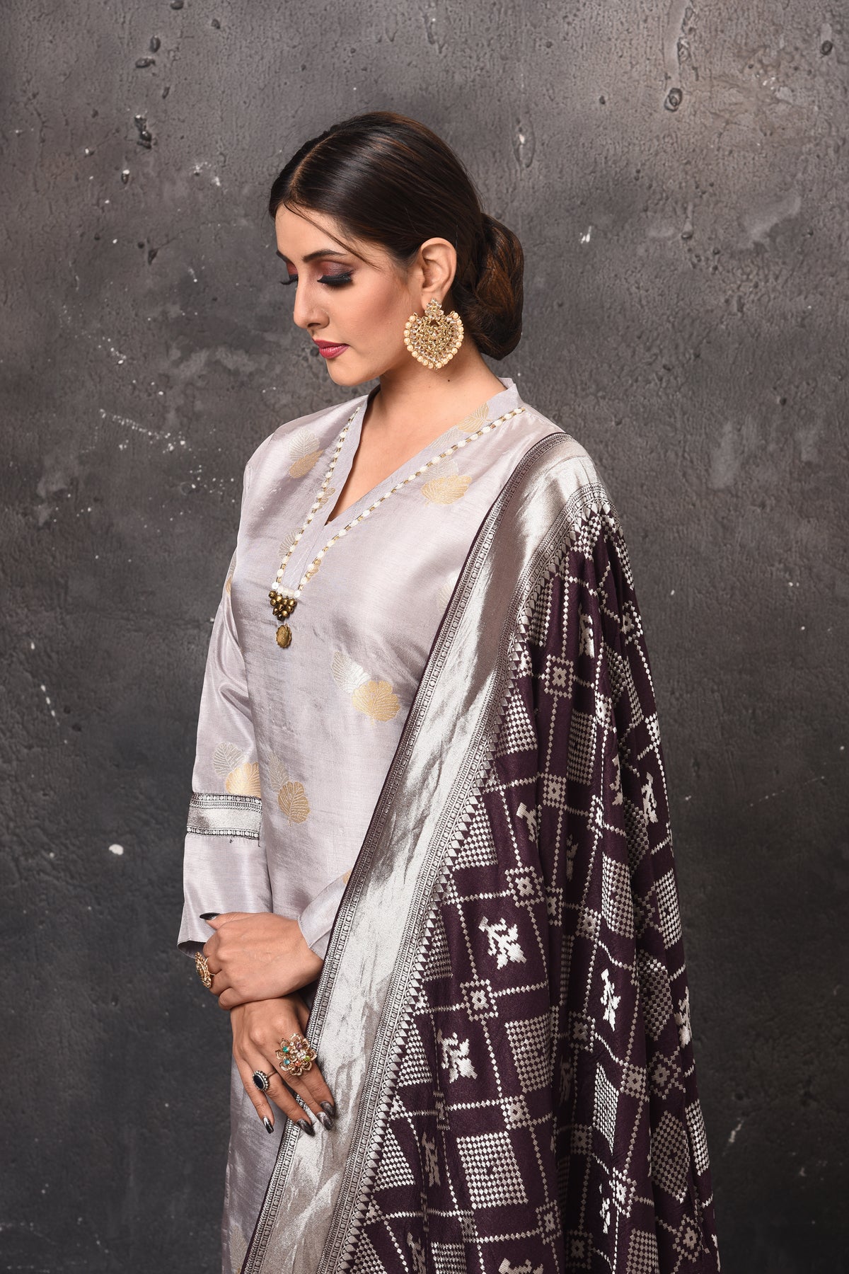 Shop stunning light grey palazzo suit online in USA with Banarasi dupatta. Get set for weddings and festive occasions in exclusive designer Anarkali suits, wedding gown, salwar suits, gharara suits, Indowestern dresses from Pure Elegance Indian fashion store in USA.-closeup