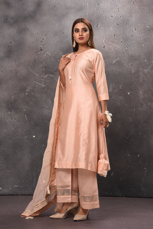 Shop beautiful light peach palazzo suit online in USA with matching dupatta. Get set for weddings and festive occasions in exclusive designer Anarkali suits, wedding gown, salwar suits, gharara suits, Indowestern dresses from Pure Elegance Indian fashion store in USA.-left