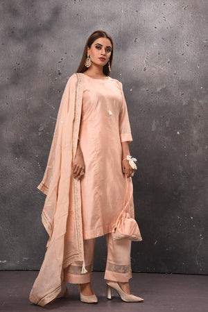 Shop beautiful light peach palazzo suit online in USA with matching dupatta. Get set for weddings and festive occasions in exclusive designer Anarkali suits, wedding gown, salwar suits, gharara suits, Indowestern dresses from Pure Elegance Indian fashion store in USA.-right