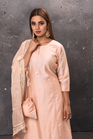 Shop beautiful light peach palazzo suit online in USA with matching dupatta. Get set for weddings and festive occasions in exclusive designer Anarkali suits, wedding gown, salwar suits, gharara suits, Indowestern dresses from Pure Elegance Indian fashion store in USA.-closeup
