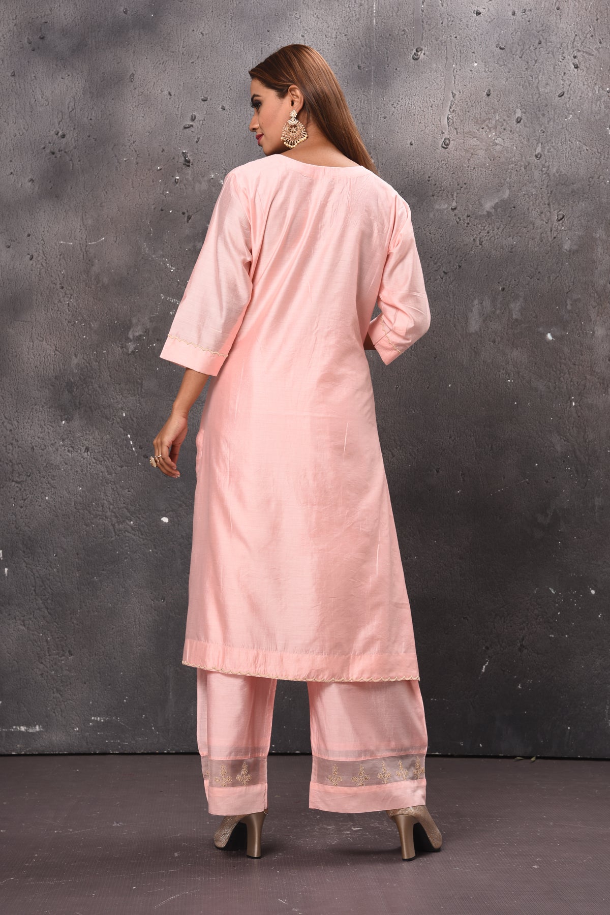 Shop elegant light pink palazzo suit online in USA with matching dupatta. Get set for weddings and festive occasions in exclusive designer Anarkali suits, wedding gown, salwar suits, gharara suits, Indowestern dresses from Pure Elegance Indian fashion store in USA.-back