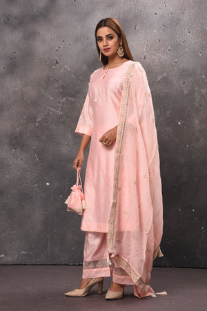 Shop elegant light pink palazzo suit online in USA with matching dupatta. Get set for weddings and festive occasions in exclusive designer Anarkali suits, wedding gown, salwar suits, gharara suits, Indowestern dresses from Pure Elegance Indian fashion store in USA.-side