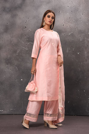 Shop elegant light pink palazzo suit online in USA with matching dupatta. Get set for weddings and festive occasions in exclusive designer Anarkali suits, wedding gown, salwar suits, gharara suits, Indowestern dresses from Pure Elegance Indian fashion store in USA.-side