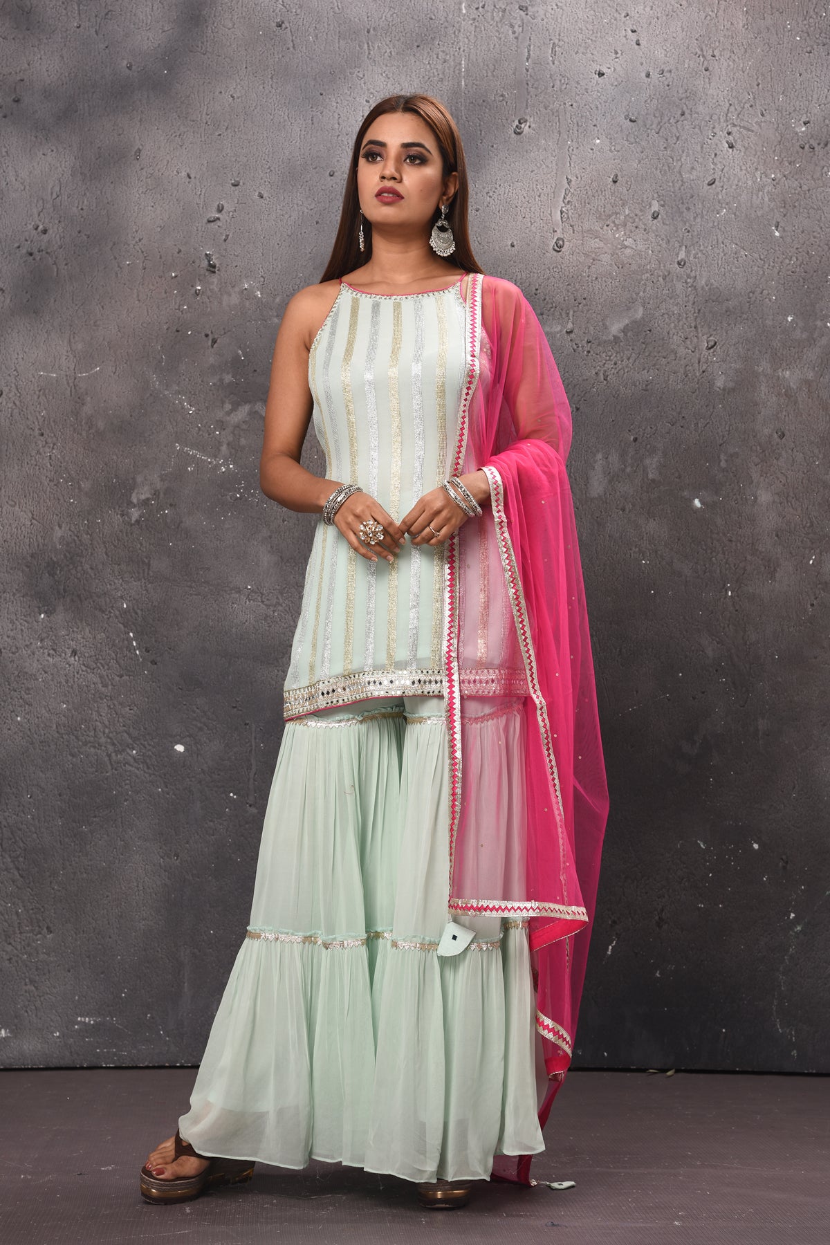 Shop beautiful mint green embellished sharara suit online in USA with pink dupatta. Get set for weddings and festive occasions in exclusive designer Anarkali suits, wedding gown, salwar suits, gharara suits, Indowestern dresses from Pure Elegance Indian fashion store in USA.-full view