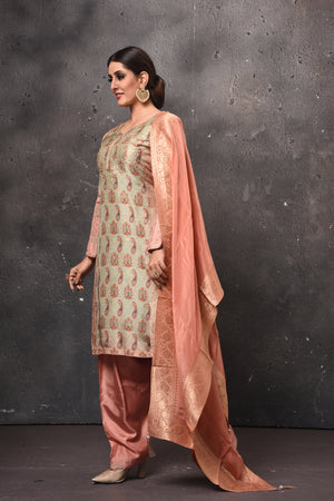 Shop stunning pista green and peach embroidered salwar suit online in USA with dupatta. Get set for weddings and festive occasions in exclusive designer Anarkali suits, wedding gown, salwar suits, gharara suits, Indowestern dresses from Pure Elegance Indian fashion store in USA.-left