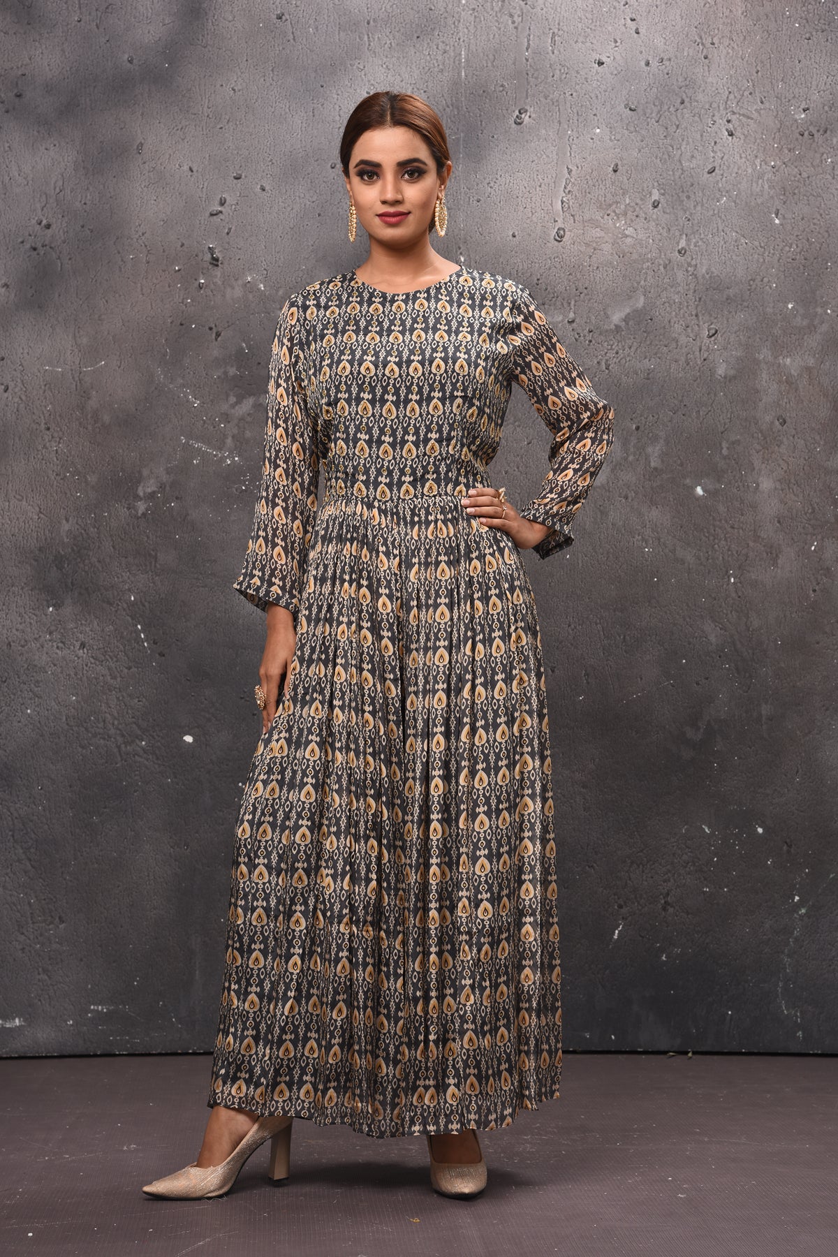 Shop beautiful dark grey printed jumpsuit online in USA with sheer back. Get set for weddings and festive occasions in exclusive designer Anarkali suits, wedding gown, salwar suits, gharara suits, Indowestern dresses from Pure Elegance Indian fashion store in USA-full view
