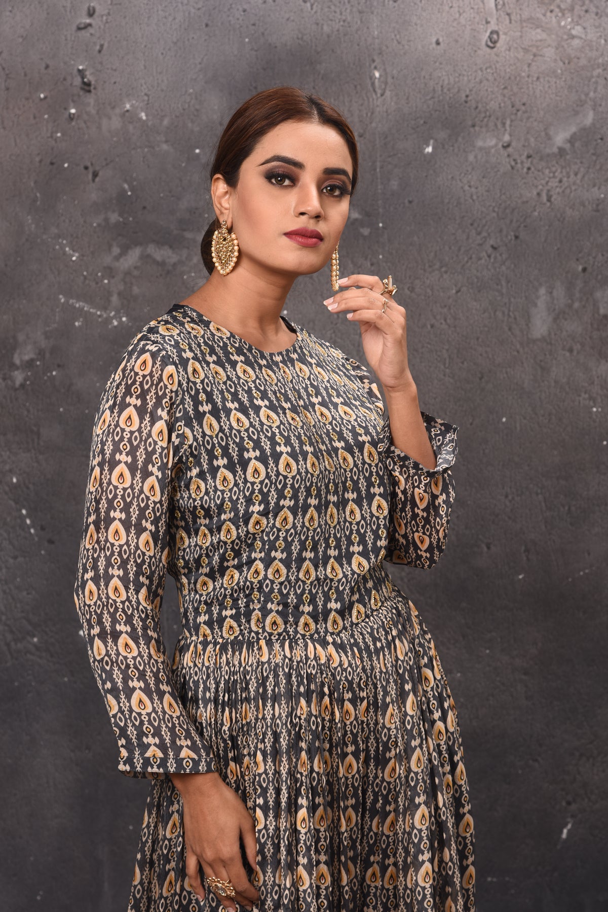 Shop beautiful dark grey printed jumpsuit online in USA with sheer back. Get set for weddings and festive occasions in exclusive designer Anarkali suits, wedding gown, salwar suits, gharara suits, Indowestern dresses from Pure Elegance Indian fashion store in USA-closeup