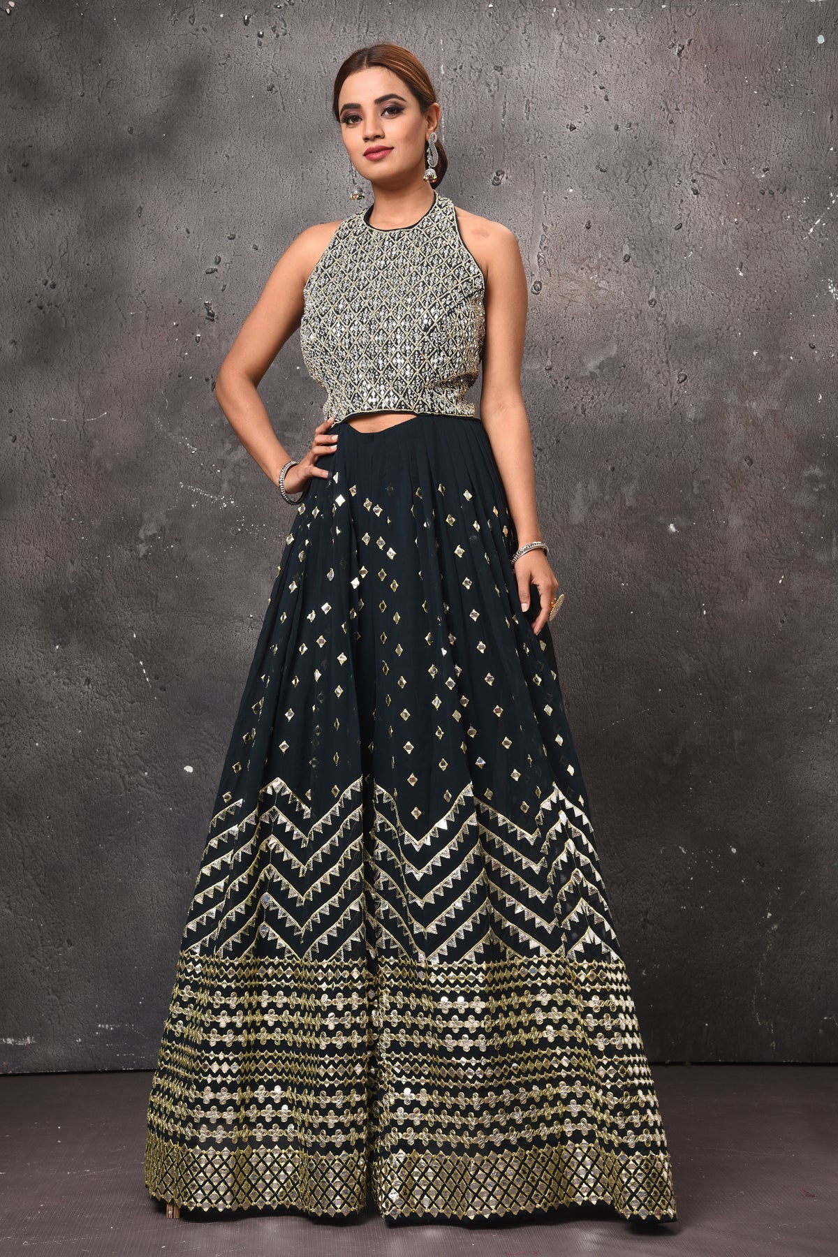 Buy black embellished palazzo online in USA with halter neck top. Get set for weddings and festive occasions in exclusive designer Anarkali suits, wedding gown, salwar suits, gharara suits, Indowestern dresses from Pure Elegance Indian fashion store in USA-full view