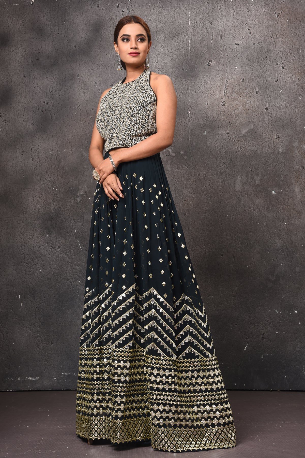 Buy black embellished palazzo online in USA with halter neck top. Get set for weddings and festive occasions in exclusive designer Anarkali suits, wedding gown, salwar suits, gharara suits, Indowestern dresses from Pure Elegance Indian fashion store in USA-side