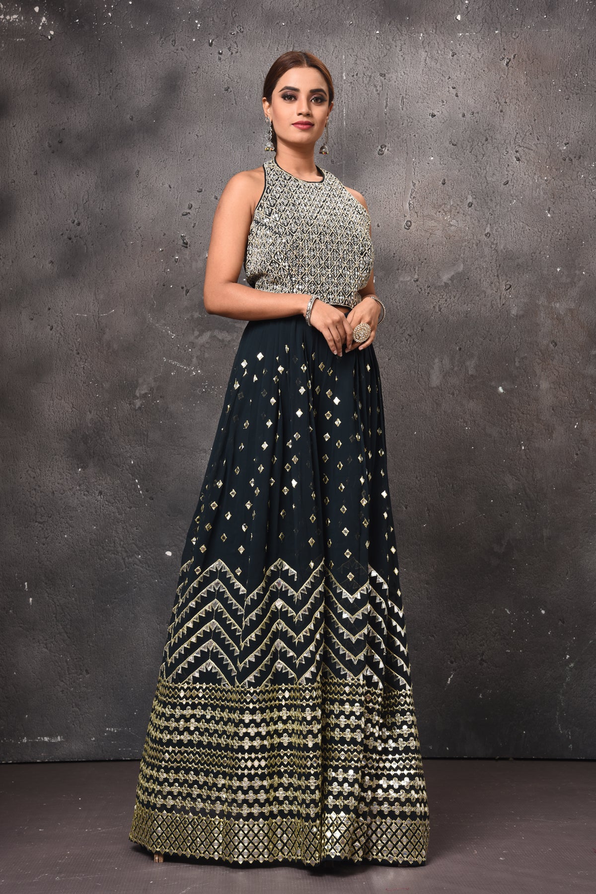 Buy black embellished palazzo online in USA with halter neck top. Get set for weddings and festive occasions in exclusive designer Anarkali suits, wedding gown, salwar suits, gharara suits, Indowestern dresses from Pure Elegance Indian fashion store in USA-right