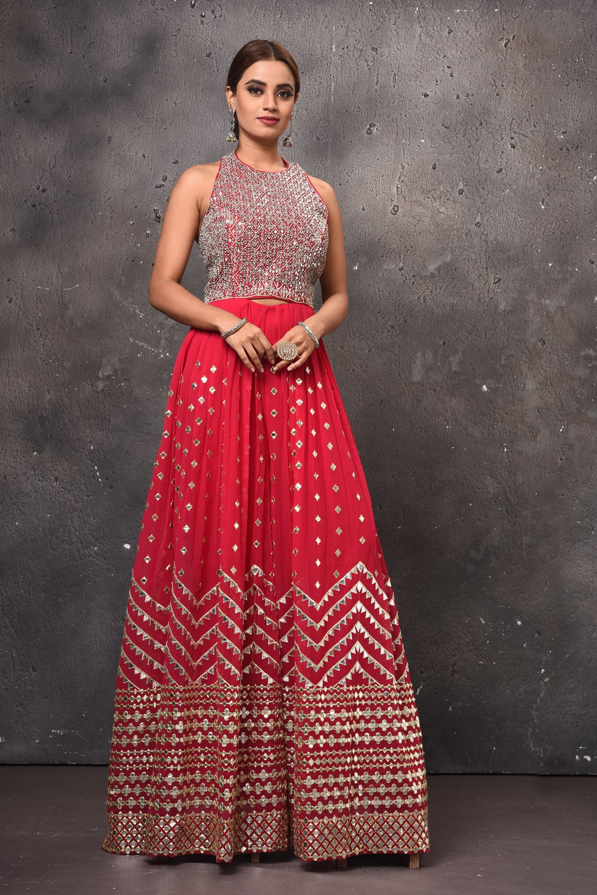 Shop beautiful pink embellished palazzo online in USA with halter neck top. Get set for weddings and festive occasions in exclusive designer Anarkali suits, wedding gown, salwar suits, gharara suits, Indowestern dresses from Pure Elegance Indian fashion store in USA-full view