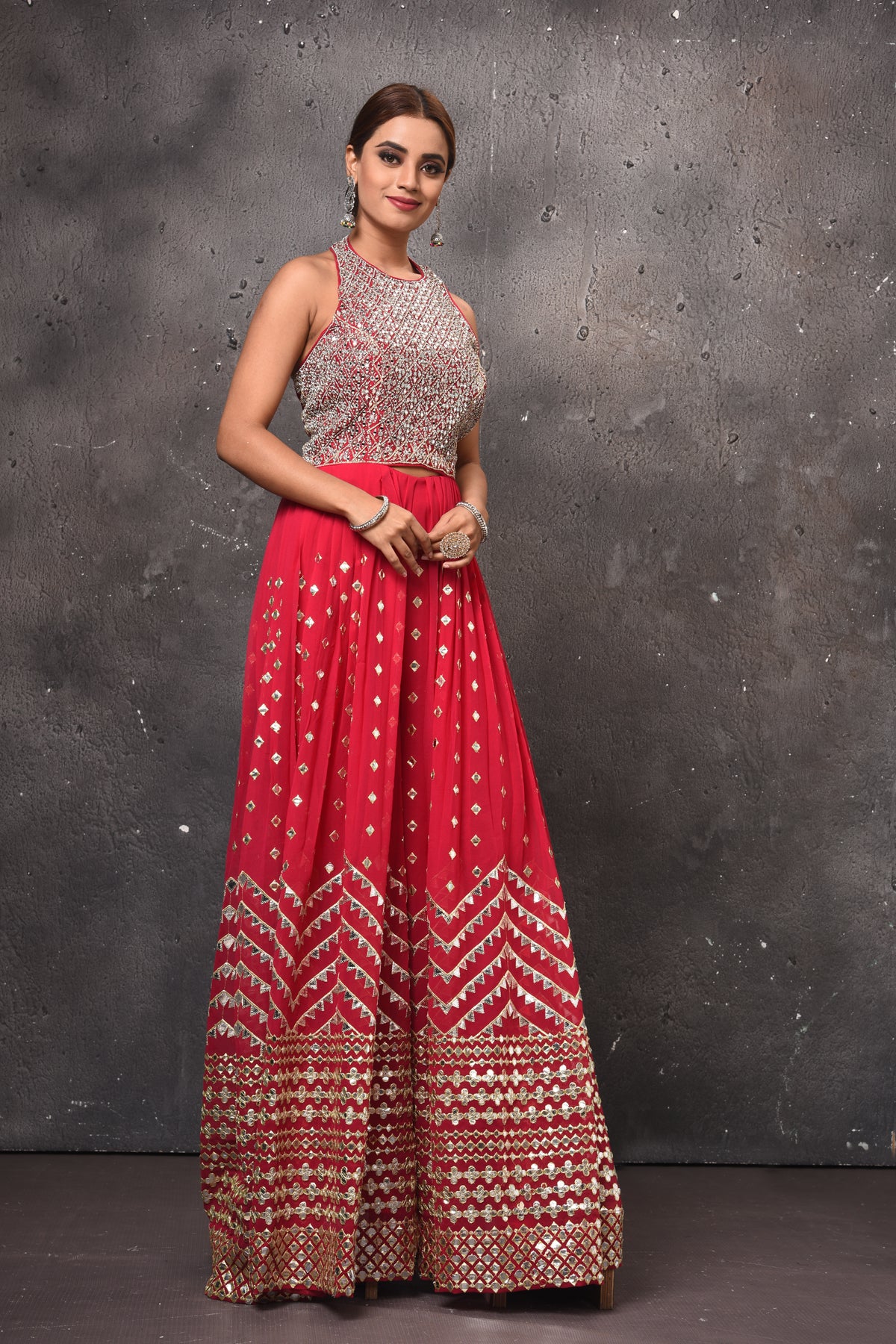 Shop beautiful pink embellished palazzo online in USA with halter neck top. Get set for weddings and festive occasions in exclusive designer Anarkali suits, wedding gown, salwar suits, gharara suits, Indowestern dresses from Pure Elegance Indian fashion store in USA-right