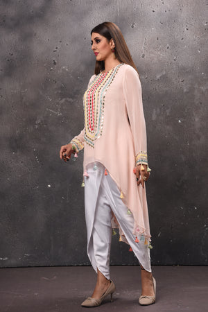 Shop beautiful cream and white embroidered salwar suit online in USA. Get set for weddings and festive occasions in exclusive designer Anarkali suits, wedding gown, salwar suits, gharara suits, Indowestern dresses from Pure Elegance Indian fashion store in USA.-side