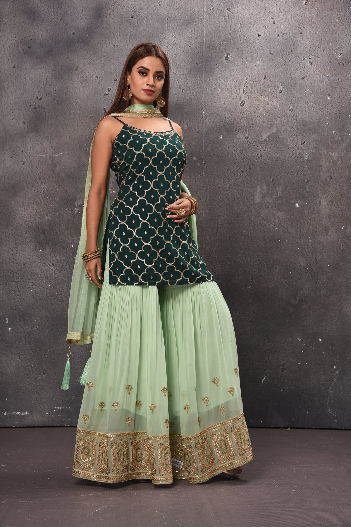 Buy beautiful mint green and dark green embroidered sharara suit online in USA. Get set for weddings and festive occasions in exclusive designer Anarkali suits, wedding gown, salwar suits, gharara suits, Indowestern dresses from Pure Elegance Indian fashion store in USA.-side